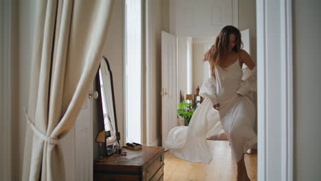 Cheerful-woman-running-morning-apartment-alone.-Positive-lady-dancing-at-house