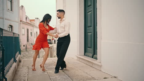 Sensual-dancers-performing-latin-american-style-on-city-street.-Couple-dancing
