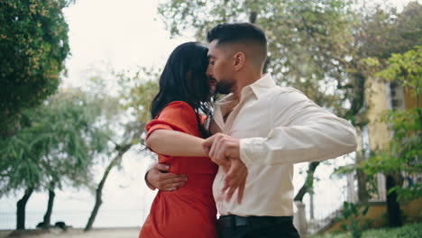 Sexy-latino-performers-dancing-passionate-choreography-in-park.-Sensual-dancers.