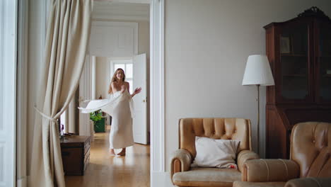 Carefree-lady-enjoying-morning-cozy-interior.-Positive-girl-dancing-at-home