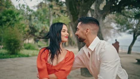 Beautiful-hispanic-couple-performing-energetic-latino-dance-in-park-close-up.