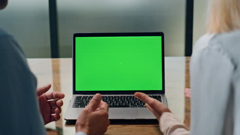 Coworkers-hands-gesturing-green-screen-computer-office.-Unknown-partners-working