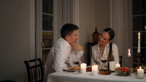 Sweet-couple-talking-at-romantic-home-evening-closeup.-Anniversary-celebration
