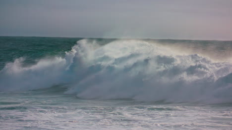 Storm-waves-rolling-ocean-surface-making-white-foam.-Powerful-surf-barreling-in