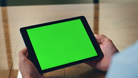 Manager-hands-using-chromakey-tablet-office-closeup.-Unknown-man-looking-device