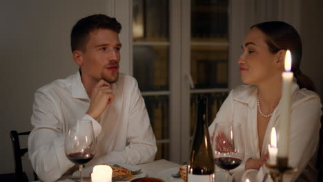 Loving-couple-talking-at-romantic-home-evening-closeup.-Lovers-enjoying-dinner