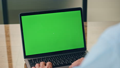 Boss-using-green-screen-laptop-in-office.-Business-man-working-mockup-computer