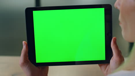 User-holding-chromakey-computer-indoors-closeup.-Woman-talking-device-video-call