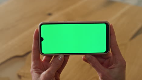 Greenscreen-phone-lady-hands-holding-office-close-up.-Woman-watching-telephone