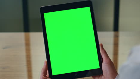Businesswoman-hands-holding-chromakey-tablet-table-closeup.-Woman-reading-email