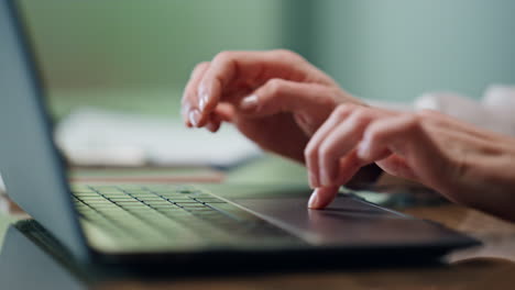 Lady-hands-texting-laptop-keyboard-office-closeup.-Unknown-businesswoman-working