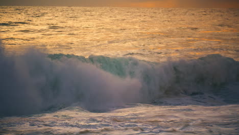 White-ocean-wave-swelling-rolling-seashore-close-up.-Powerful-surf-splashing
