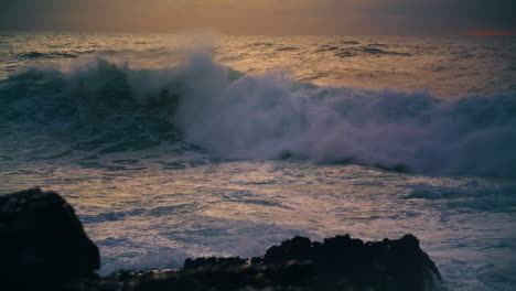 Sea-waves-breaking-shallow-reef-in-morning.-Powerful-surf-barreling-crash-rocky