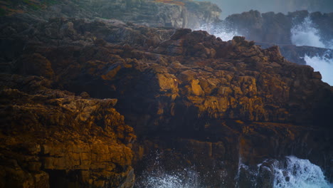 Wild-ocean-cliff-view-on-storm-day-closeup.-Powerful-waves-splashing-hitting