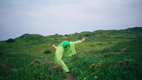 Passionate-girl-dancer-performing-contemporary-style-at-field-cloudy-vertical