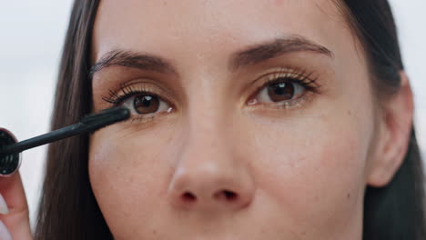 Closeup-woman-colouring-eyelashes-indoor.-Portrait-lady-applying-mascara-makeup