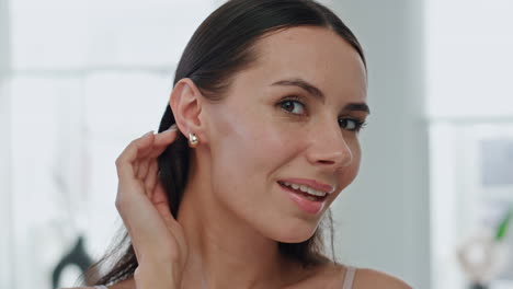 Happy-model-putting-earrings-home-pov-video.-Satisfied-woman-straightening-hair
