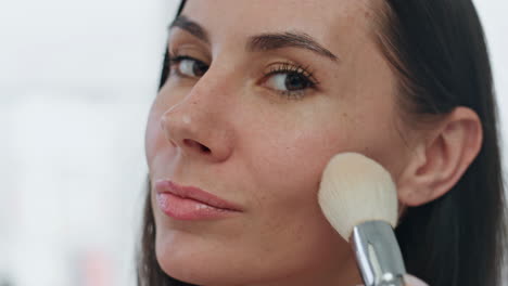Portrait-model-applying-powder-home.-Smiling-woman-putting-blushes-making-makeup