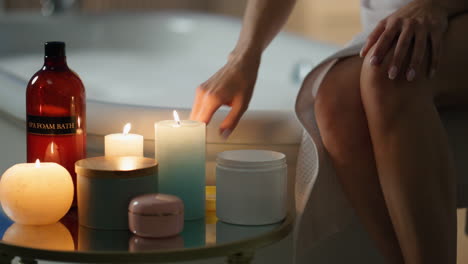 Girl-moisturizing-hands-evening-room-closeup.-Relaxed-woman-applying-skin-cream