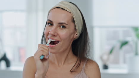 Pov-cheerful-model-brushing-mouth-bathroom.-Close-up-happy-woman-cleaning-teeth