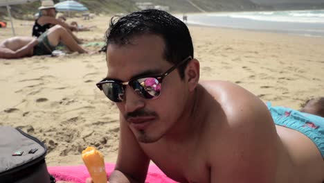 Hispanic-Male-Eating-an-Ice-Cream-Cone-at-the-Beach