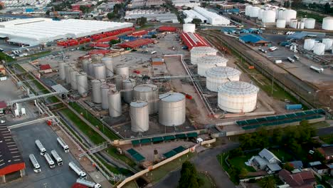 Rising-drone-view-of-fuel-depot-and-tankers