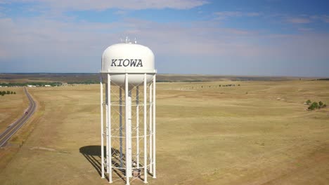 Drone-view-of-a-water-tank-reserve-serving-as-a-cellular-tower-in-Kiowa,-Colorado