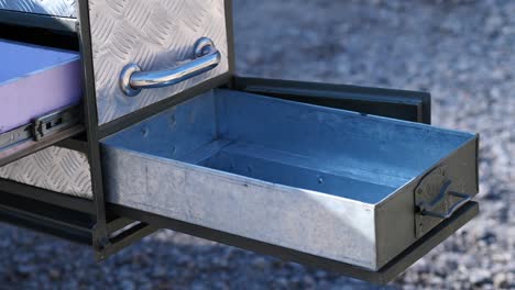 Close-up-view-of-drawer-in-camper-van-in-silver-color