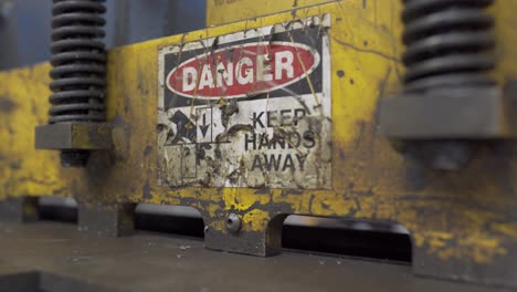 Danger-Sign-On-A-Industrial-Fabricating-Sheer-Machine