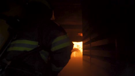 Slow-motion-reveal-of-brave-firefighters-battling-a-blaze-in-a-building