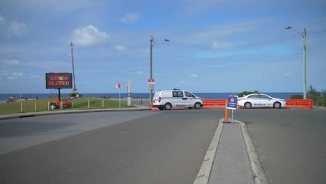 Closed-road---Emergency-vehicles-parked---Clovelly-Beach,-Sydney,-Australia