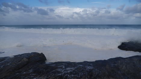 Beautiful-white-waves-splashing-on-rocks---Clovelly-Cliff-Sydney-Australia