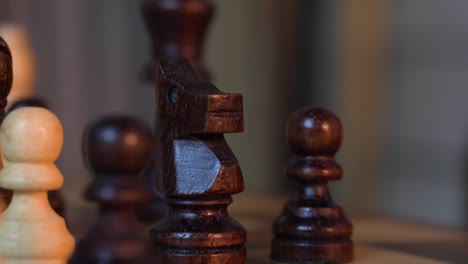 Shiny-Wooden-Chess-Pieces-Used-In-A-Game---close-up-shot