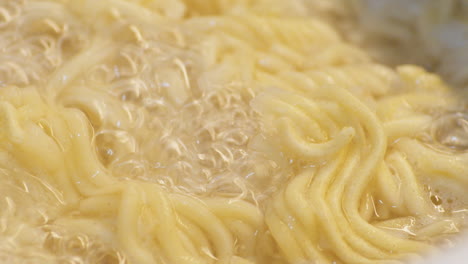 Instant-Ramen-Noodles-Cooked-In-A-Boiling-Water-With-Bubbles