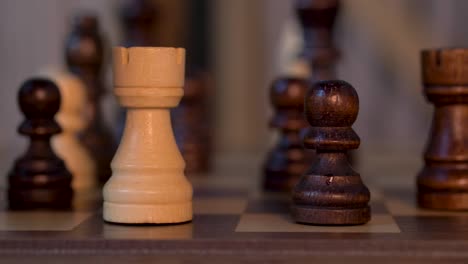 White-Bishop-Takes-Pawn-In-Chess-Match---close-up-shot