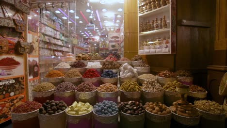 Colorful-Spices-At-Traditional-Arabic-Market,-Moving-Backward