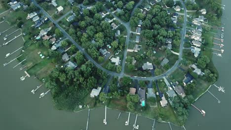 Birdseye-Aerial-View-of-Kent-Island-Coast,-Houses-and-Docks