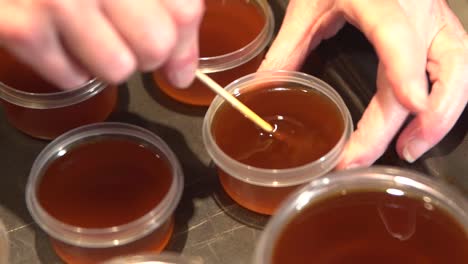 Stirring-and-cooling-cannabis-salve-oil-mixed-in-melted-beeswax-and-shea-butter
