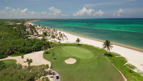 Flying-Over-Golf-Course-On-Playa-Del-Carmen-Beach,-Riviera-Maya,-Mexico