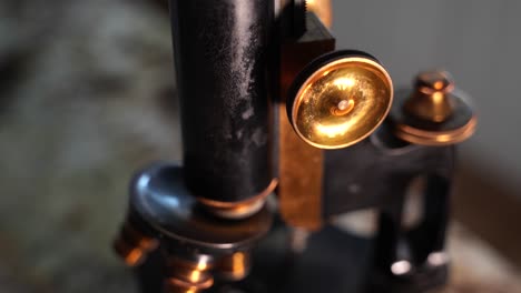 Antique,-vintage-microscope---close-up-tilt-down-reveal