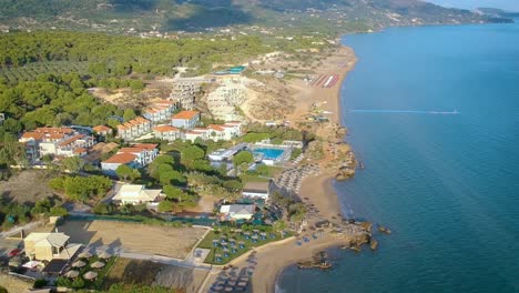 Aerial-Over-Beach-Coastline-With-Hotel-Resorts-In-Zakynthos,-Greece