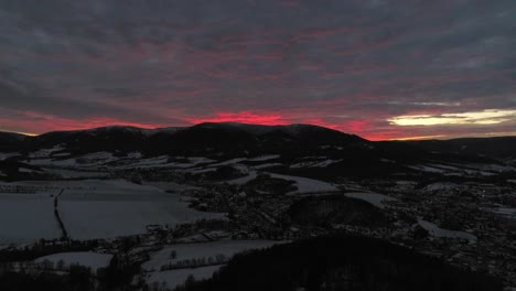 The-fiery-red-sunset-behind-the-mountains-of-Jesenik,-Czech-Republic---wide-shot