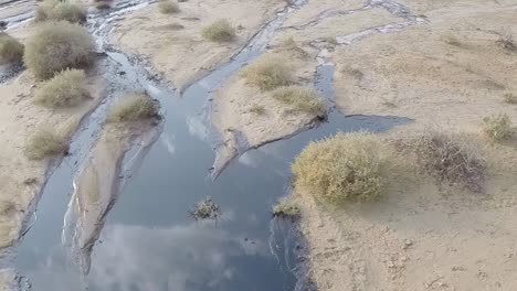The-oil-spill-over-a-sandy-landscape---close-up