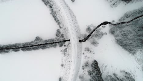 The-beautiful-snow-white-landscape-and-trail-of-Ramzova,-Czech-Republic---aerial