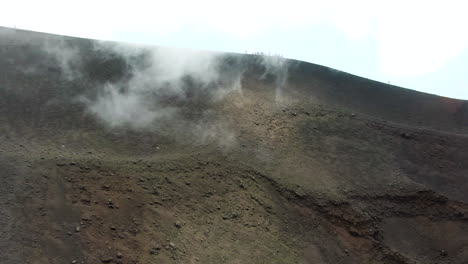 Cloud-of-smoke-spreading-on-the-Torre-del-Filosofo-on-Etna,-Sicily