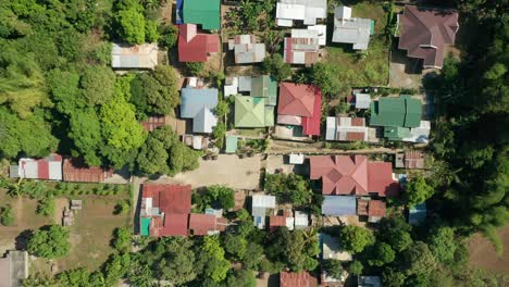 Aerial-View-from-East-to-West-of-a-Small-Modern-Village-in-the-Philippines-in-4K