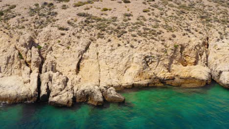 Adriatic-Sea-Cliffs-at-Golden-Bay-Beach-on-Island-of-Krk-in-Croatia,-Aerial