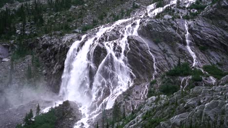 Footage-of-a-huge-waterfall-in-Glacier-National-Park,-BC,-Canada