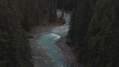 Aerial-drone-footage-of-a-river-and-forest-filled-with-moody-fog-in-British-Columbia