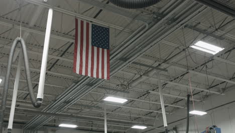 An-American-flag-hangs-from-the-ceiling-of-an-auto-garage